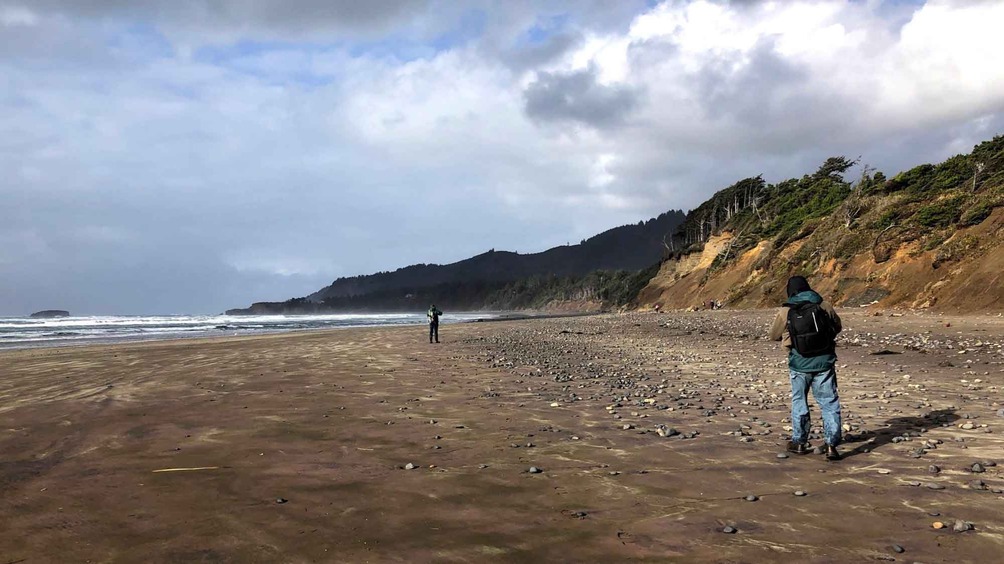 Photograph of two people on a beach.