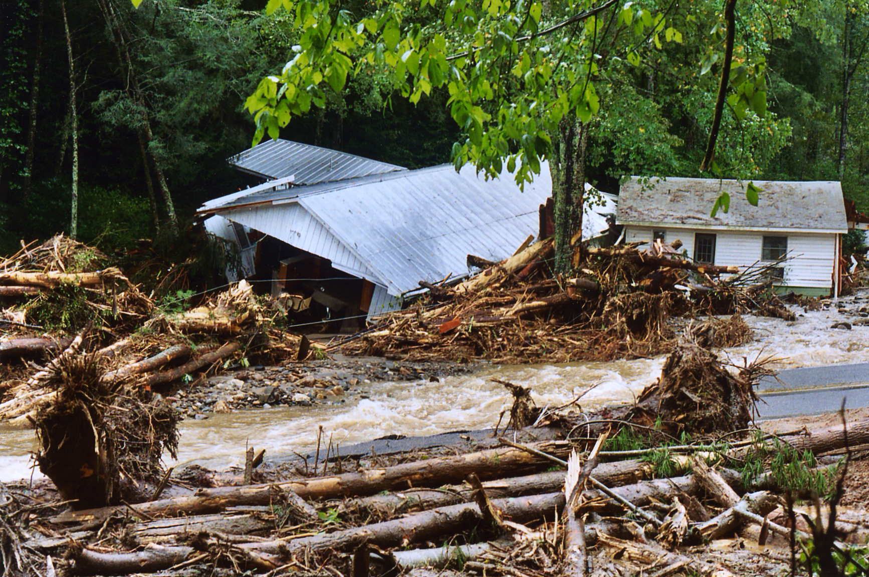 Photograph of a house in North Carolina destroyed by a landslide.