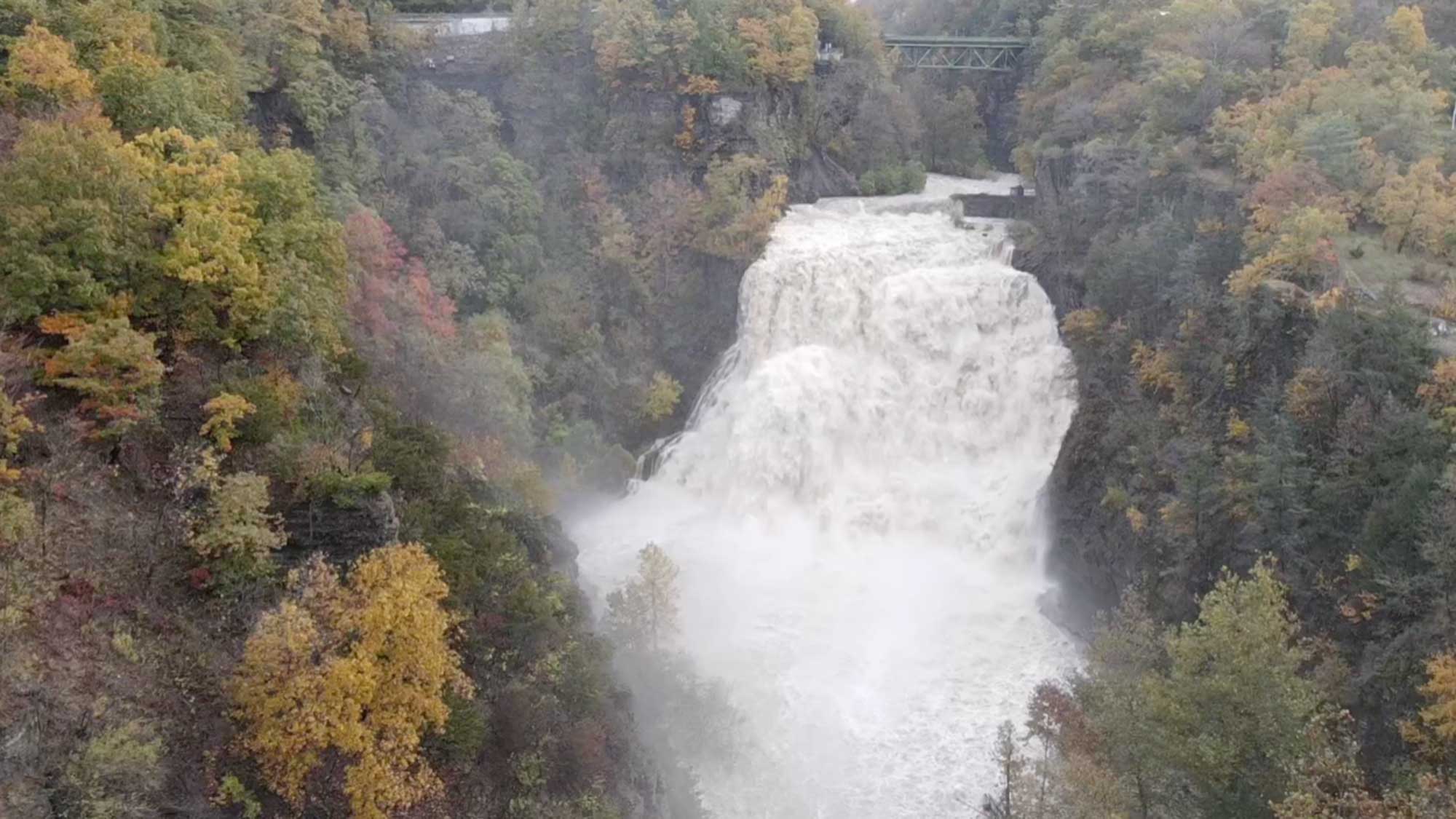 Photograph of Ithaca Falls captured at a time of very high water flow.