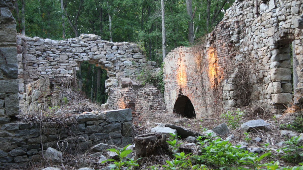 Photo of crumbling stone and brick structures related to historical mining activity in Midlothian, Virginia.
