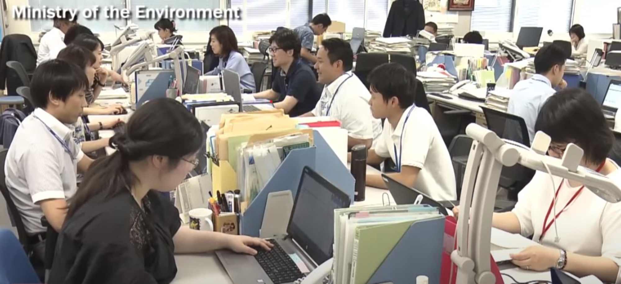 Photo of office workers in Japan's Ministry of the Environment wearing casual clothing to keep them cool.
