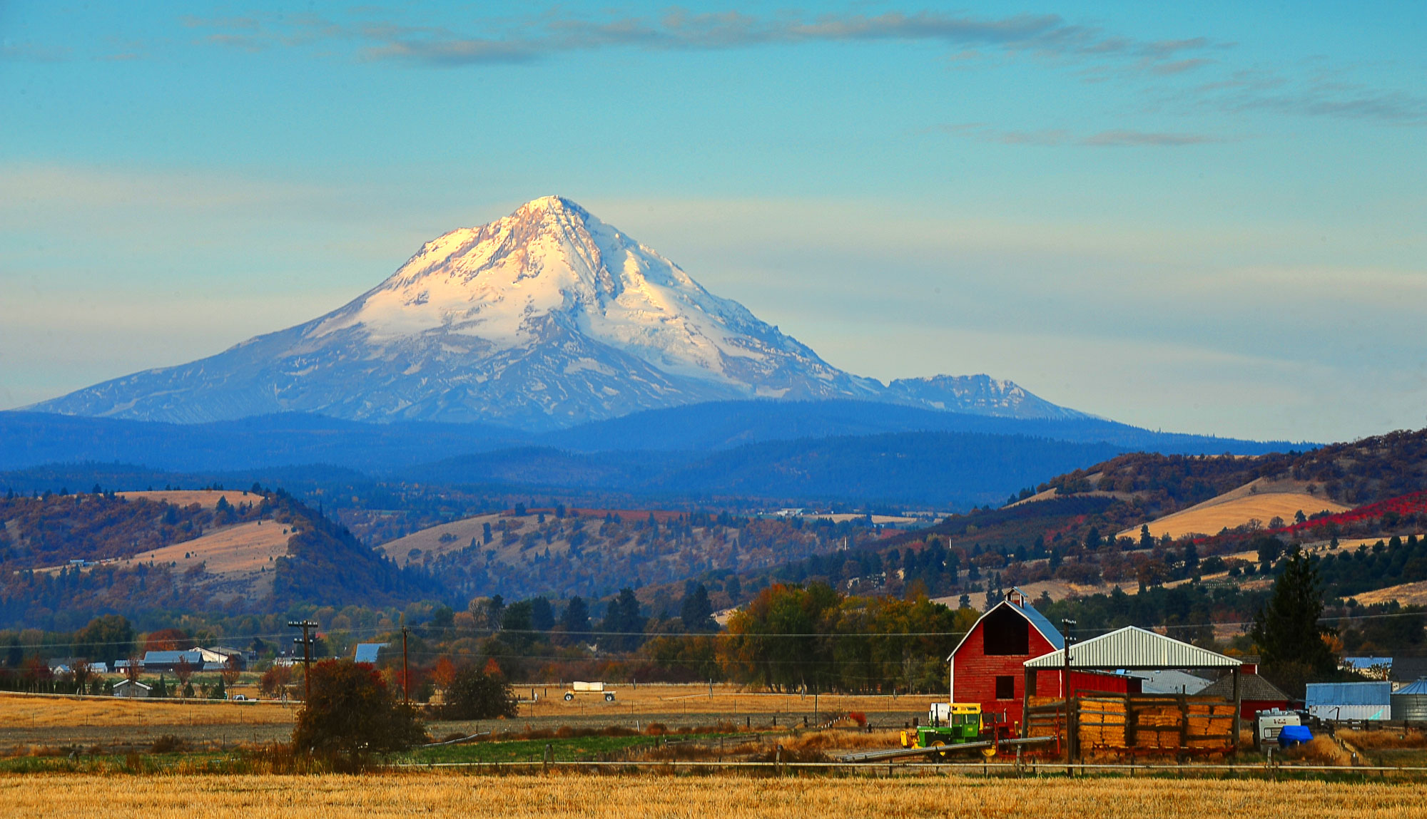 Photograph of Mt. Hood in Oregon. The mountain has the classic conical shape of a stratovolcano.
