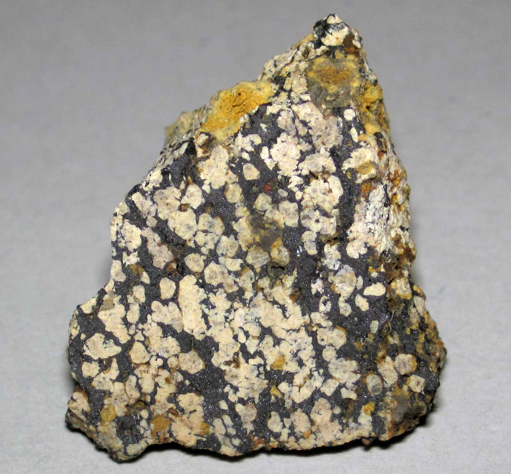 Photograph of a sample of Nelsonite, the state rock of Virginia.