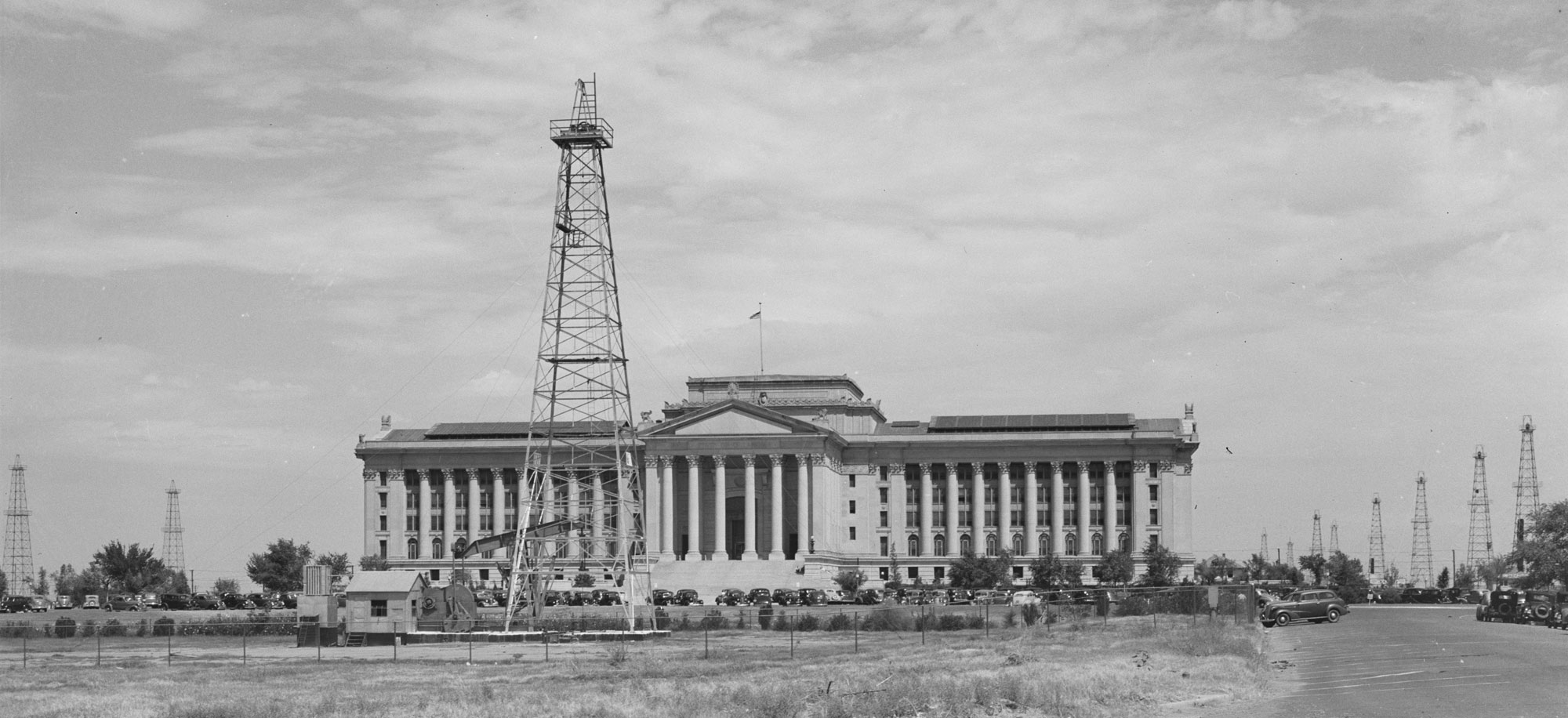 Black-and-whtie photo of oil derricks around the state capital building in Oklahoma City, Oklahoma, 1939.