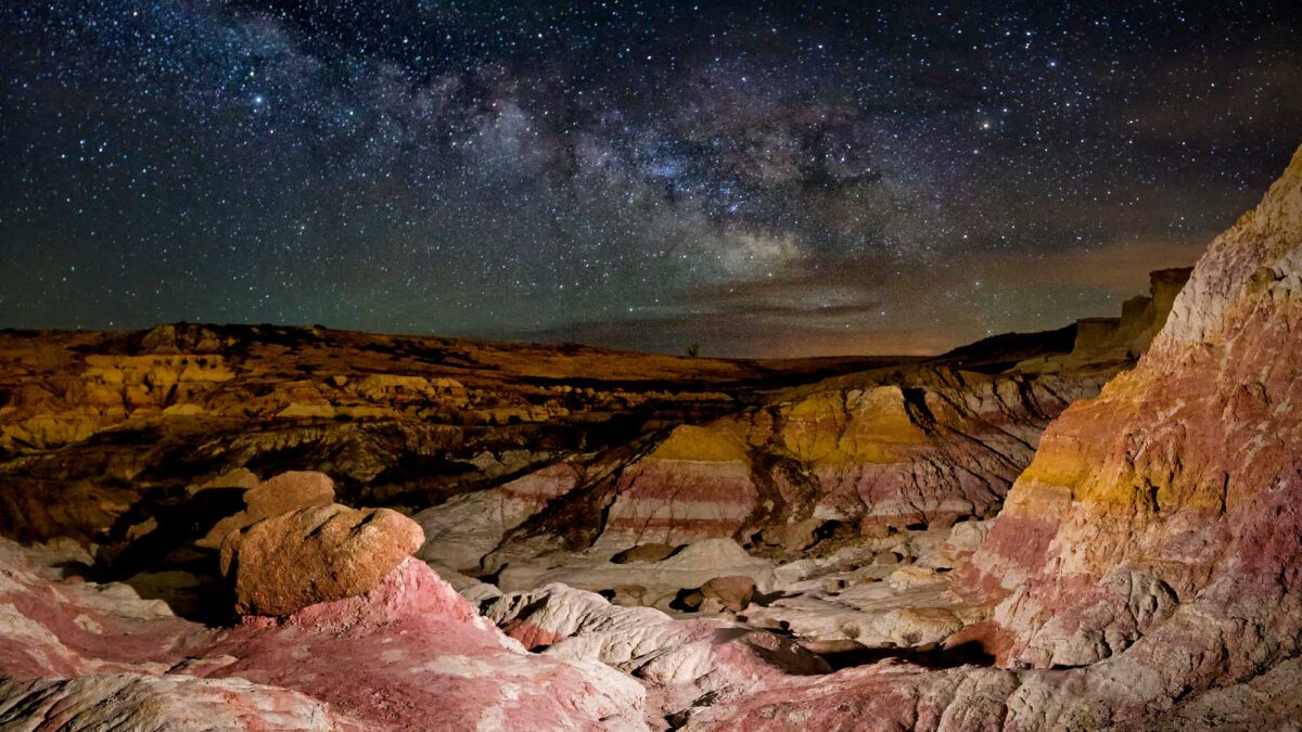 Photograph of the night sky and Milky Way over the Paint Mines Interpretive Center in Colorado.