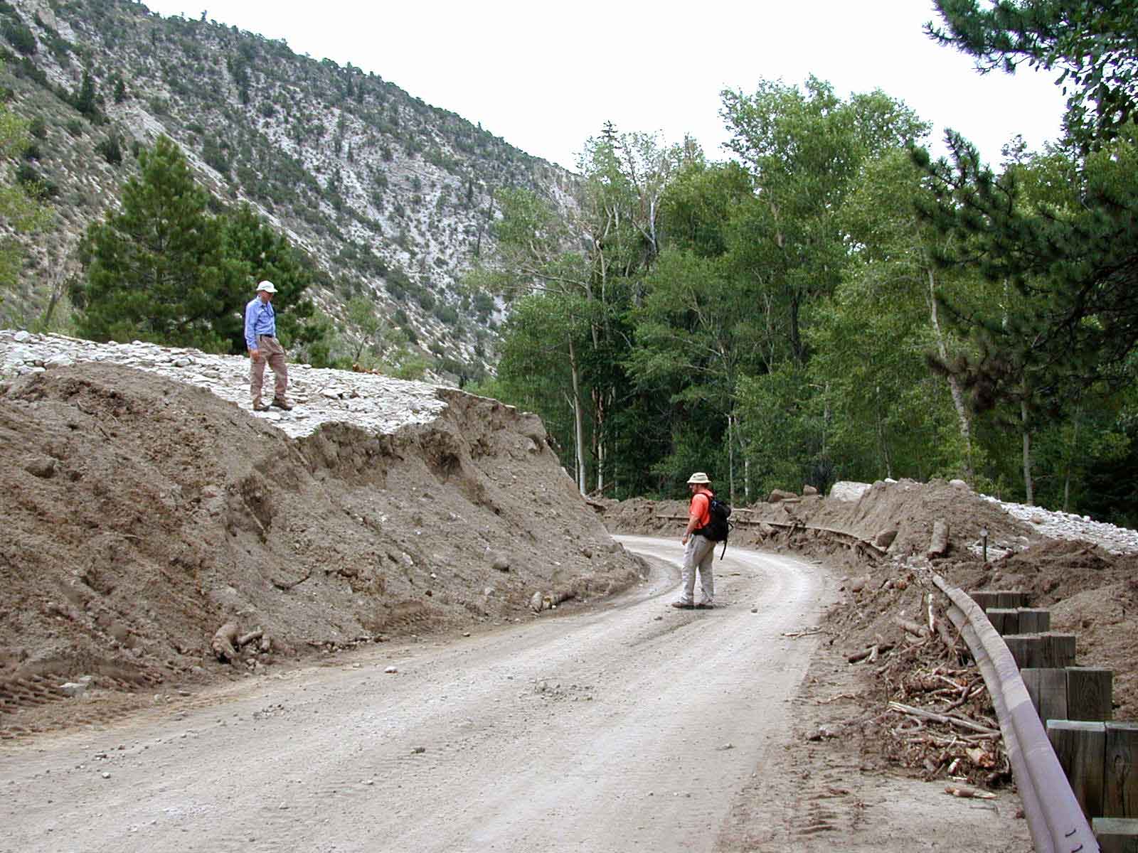 Photograph showing a debris flow that had covered a road before it was re-excavated.