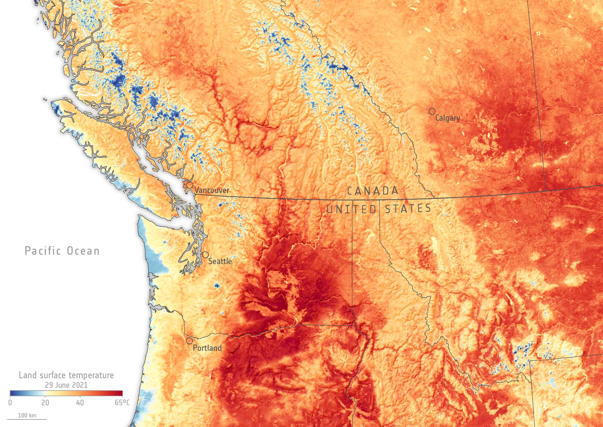 Map colored to show the land surface temperature of southwestern Canada and the northwestern U.S. during the heat dome of June 2021. The map shows cooler areas in blue and warmer areas in orange and red. Much of the map is colored orange or red, indicating high land surface temperatures.