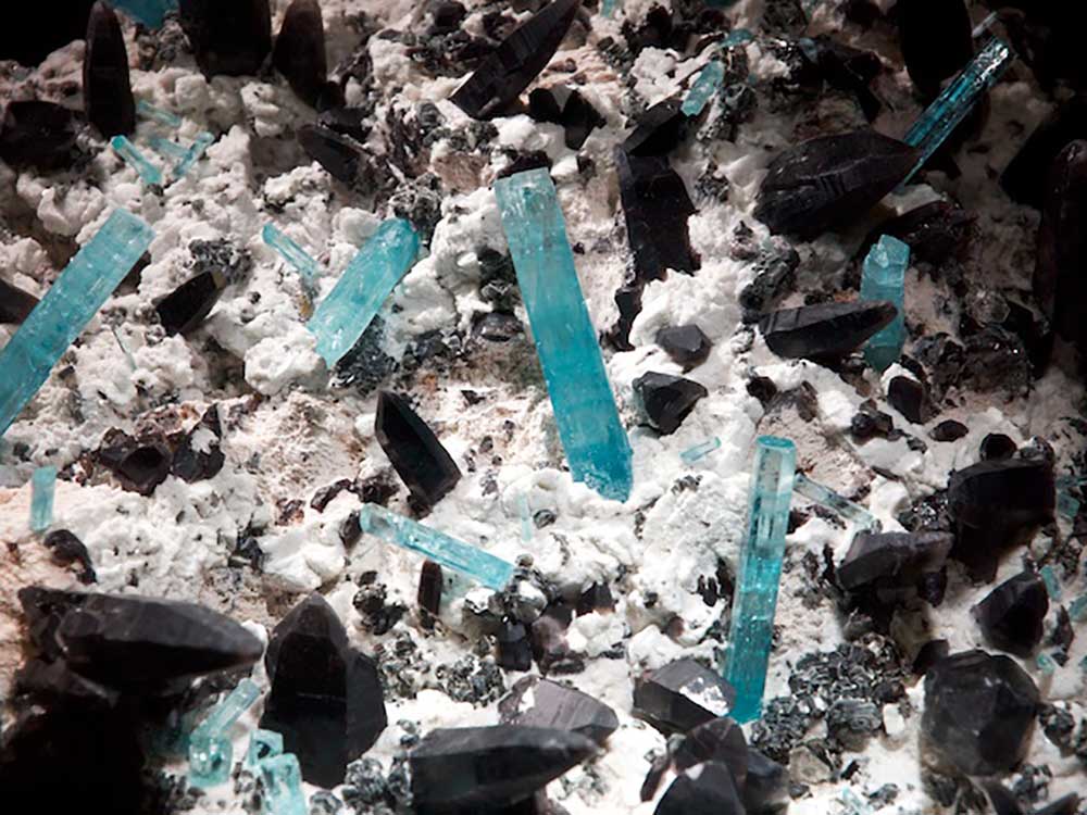 Photograph of crystals of the gemstone aquamarine.