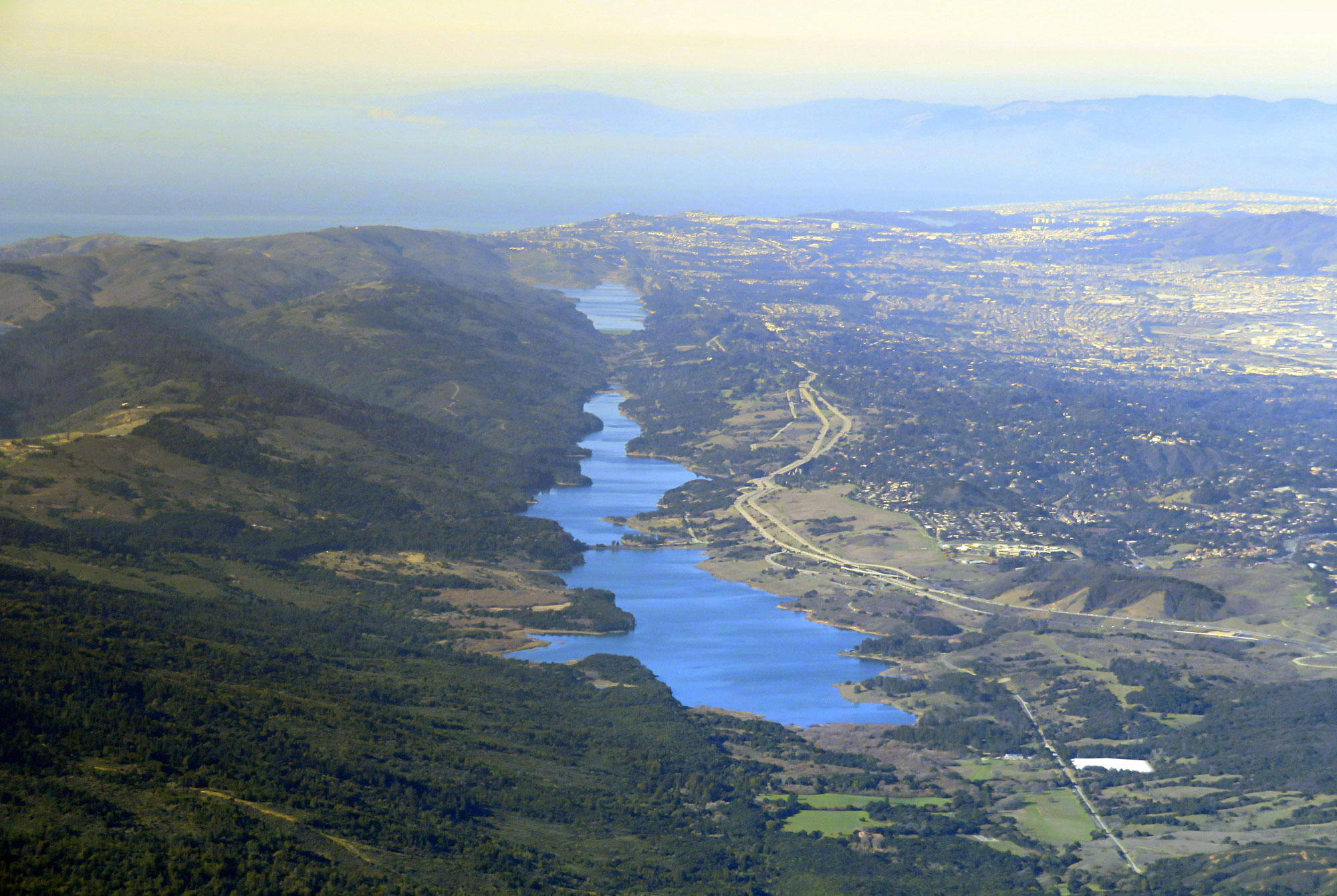 Aerial photograph of Crystal Springs Reservoir and San Andreas Lake, two elongated bodies of water that occur in the valley formed by the San Andreas Fault near the coast of Central California.