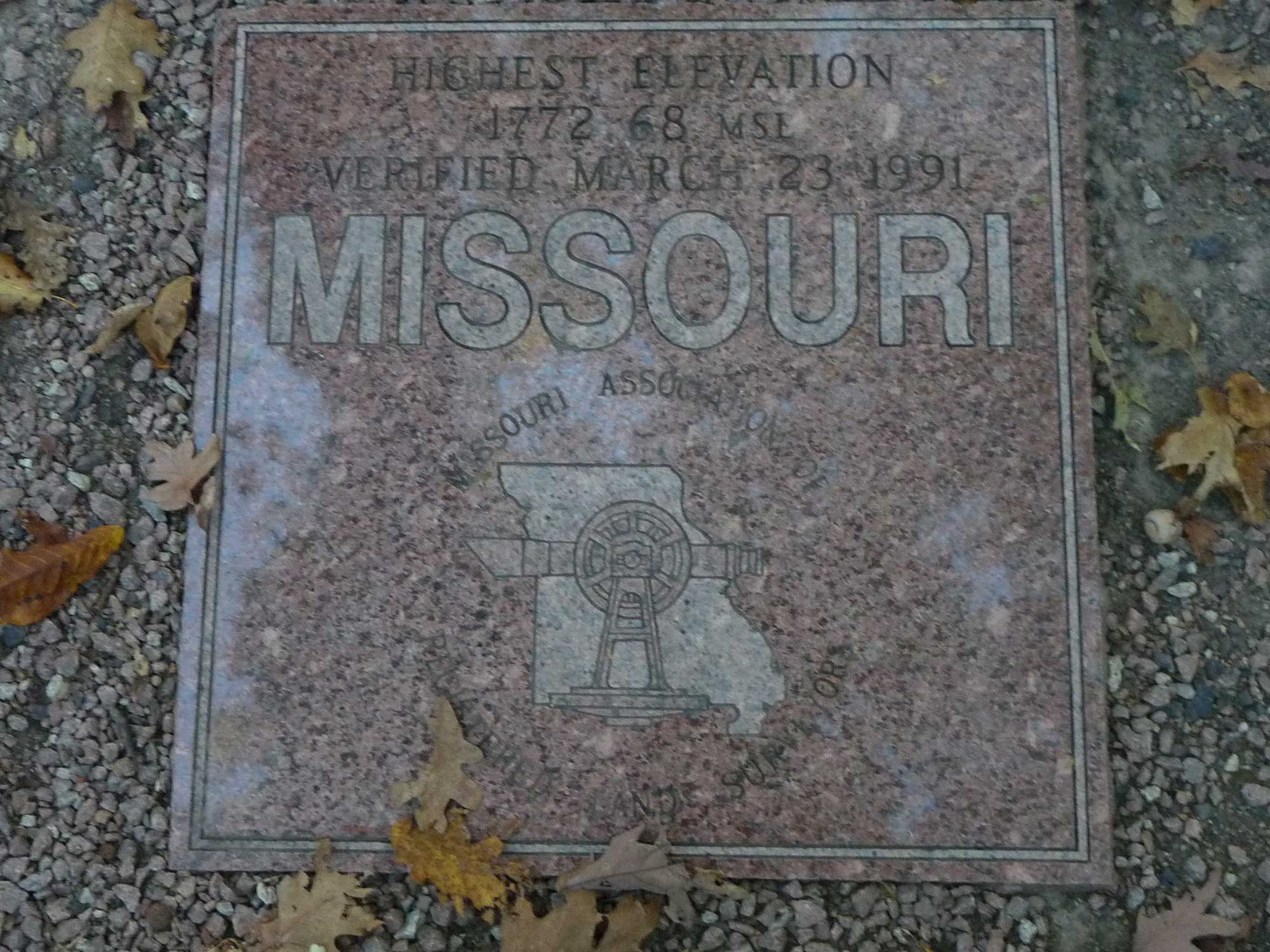 Photograph of a marker sign that indicates the point of highest elevation in Missouri.