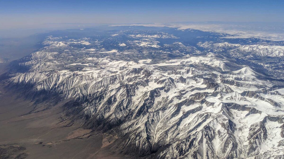 Photograph showing an aerial view of the Sierra Nevada Mountains in California, including Mount Whitney.