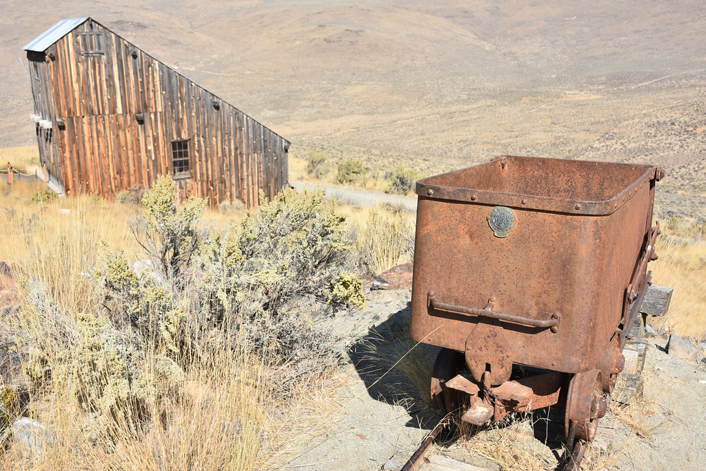 Photograph of a mining cart and a recreated entrance to a mining lode at Baker City, Oregon.