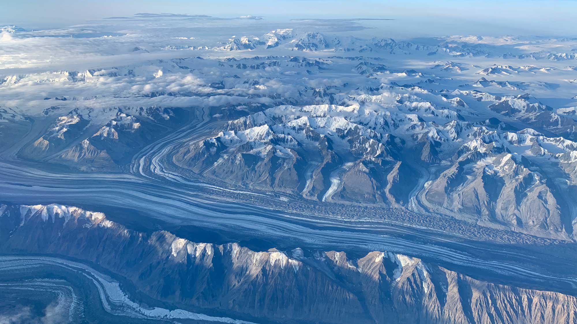 Aerial photograph of river-like glaciers in Alaska.