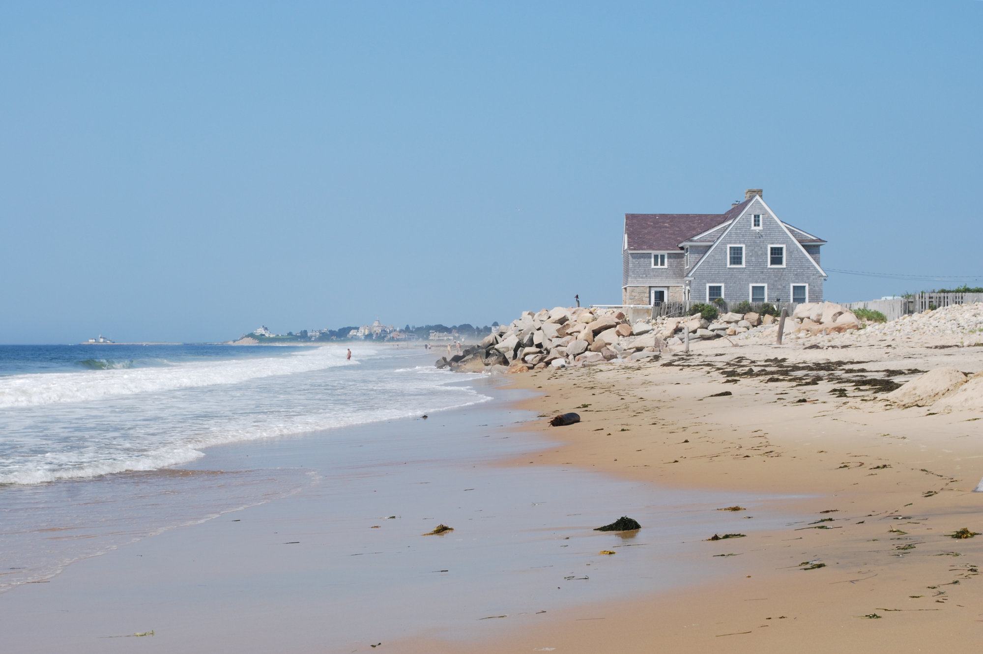 Photo of a house right along the beach.