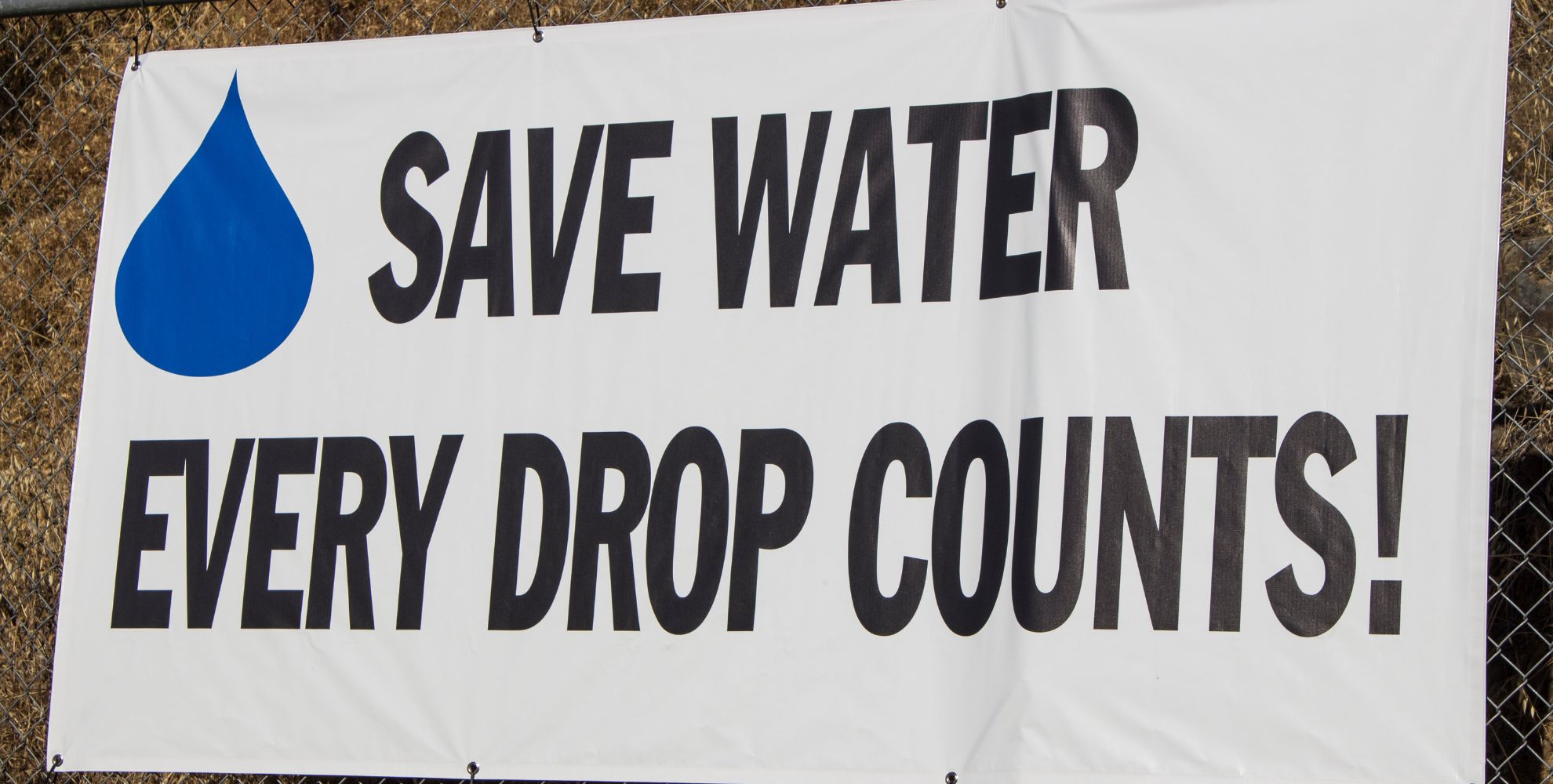 Image of a sign that says "Save Water, Every Drop Counts!"