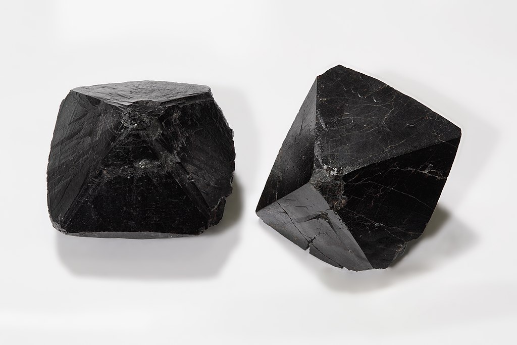 Photograph of two samples of cassiterite.