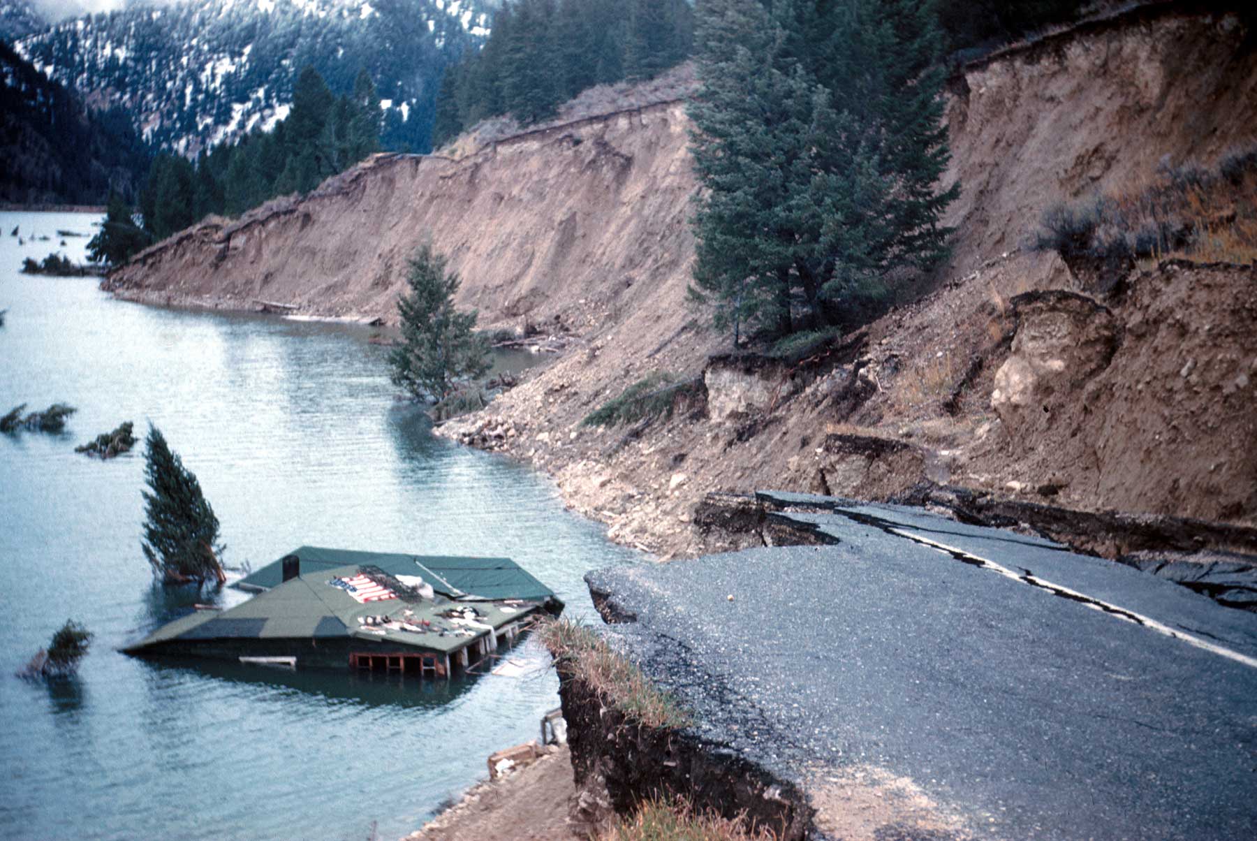 Photograph of damage to a road next to Hebgen Lake, Montana, which resulted from an earthquake.