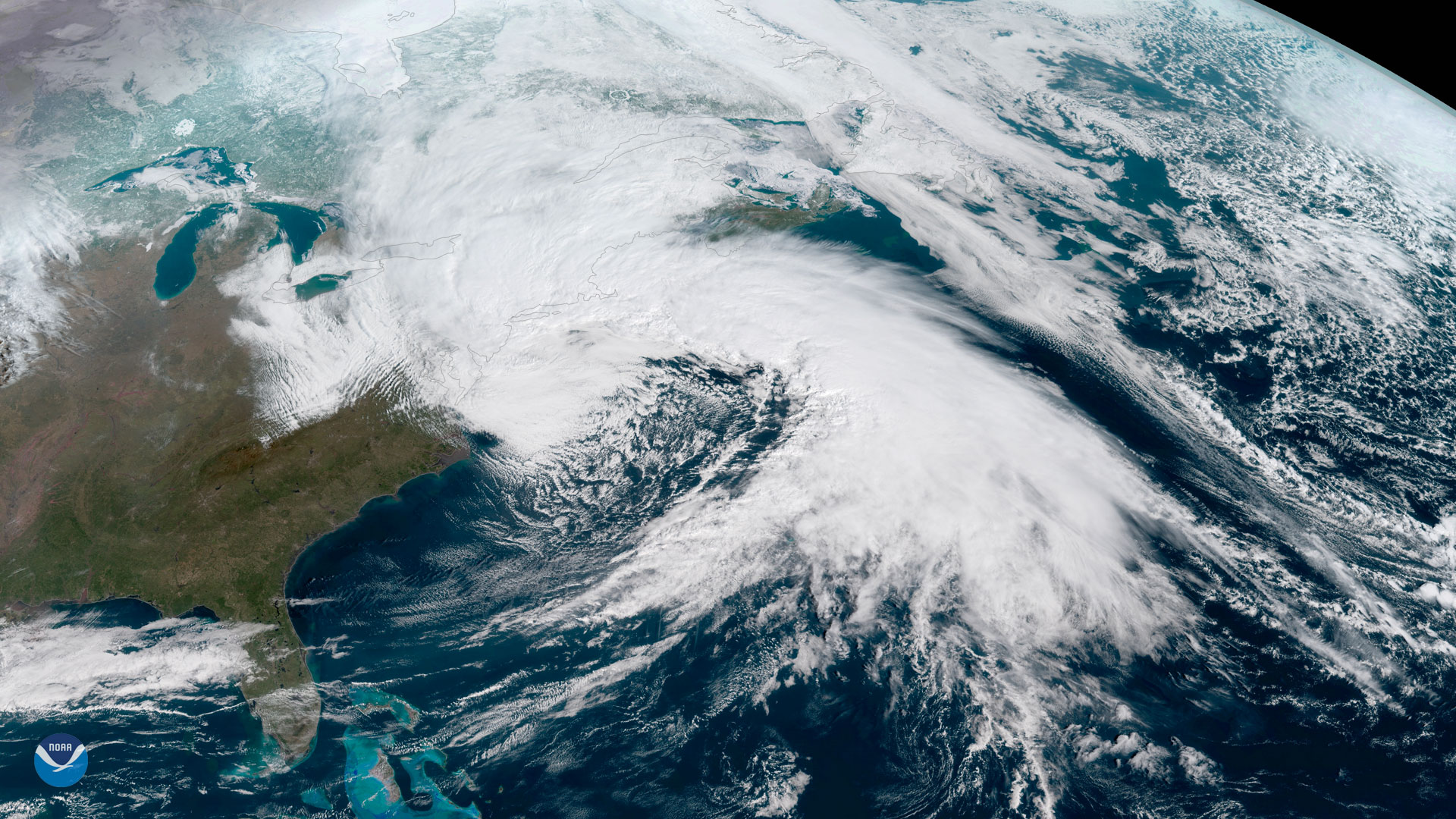 Satellite image of the eastern United States showing a Nor'easter over the northeast on March 2, 2018. The image shows a large, white cloud over the northeastern United States and extending both northward and eastward into the Atlantic Ocean.