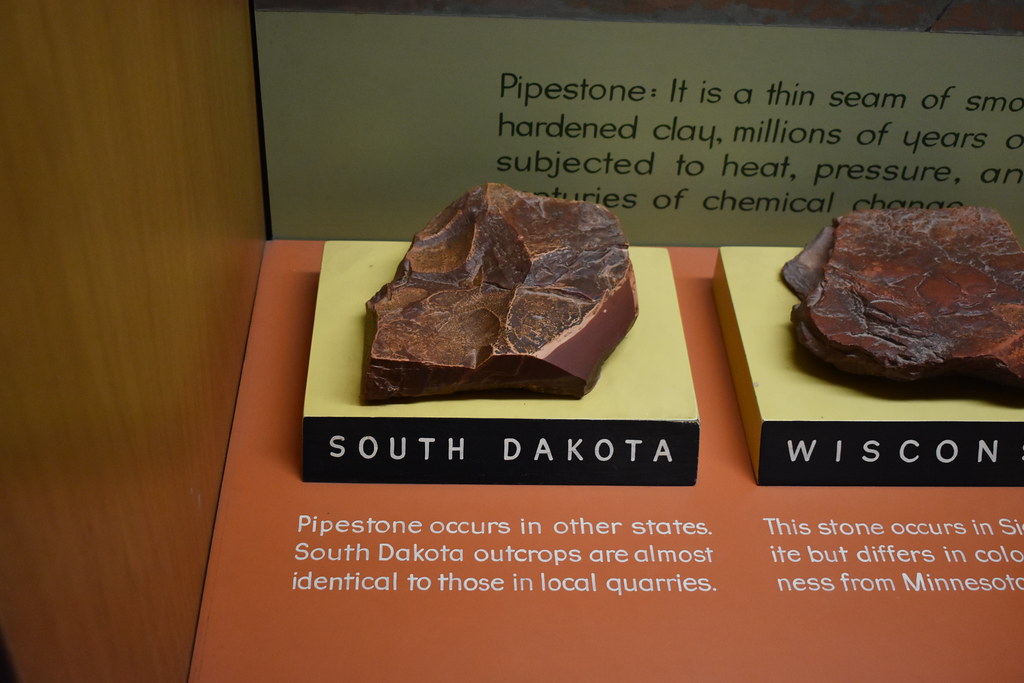Photograph of a sample of pipestone from South Dakota on display in a museum exhibit.