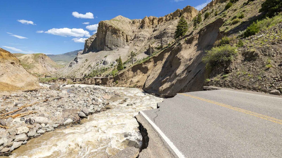 Photograph of damage to a road entrance to Yellowstone National Park resulting from June 2022 flooding.