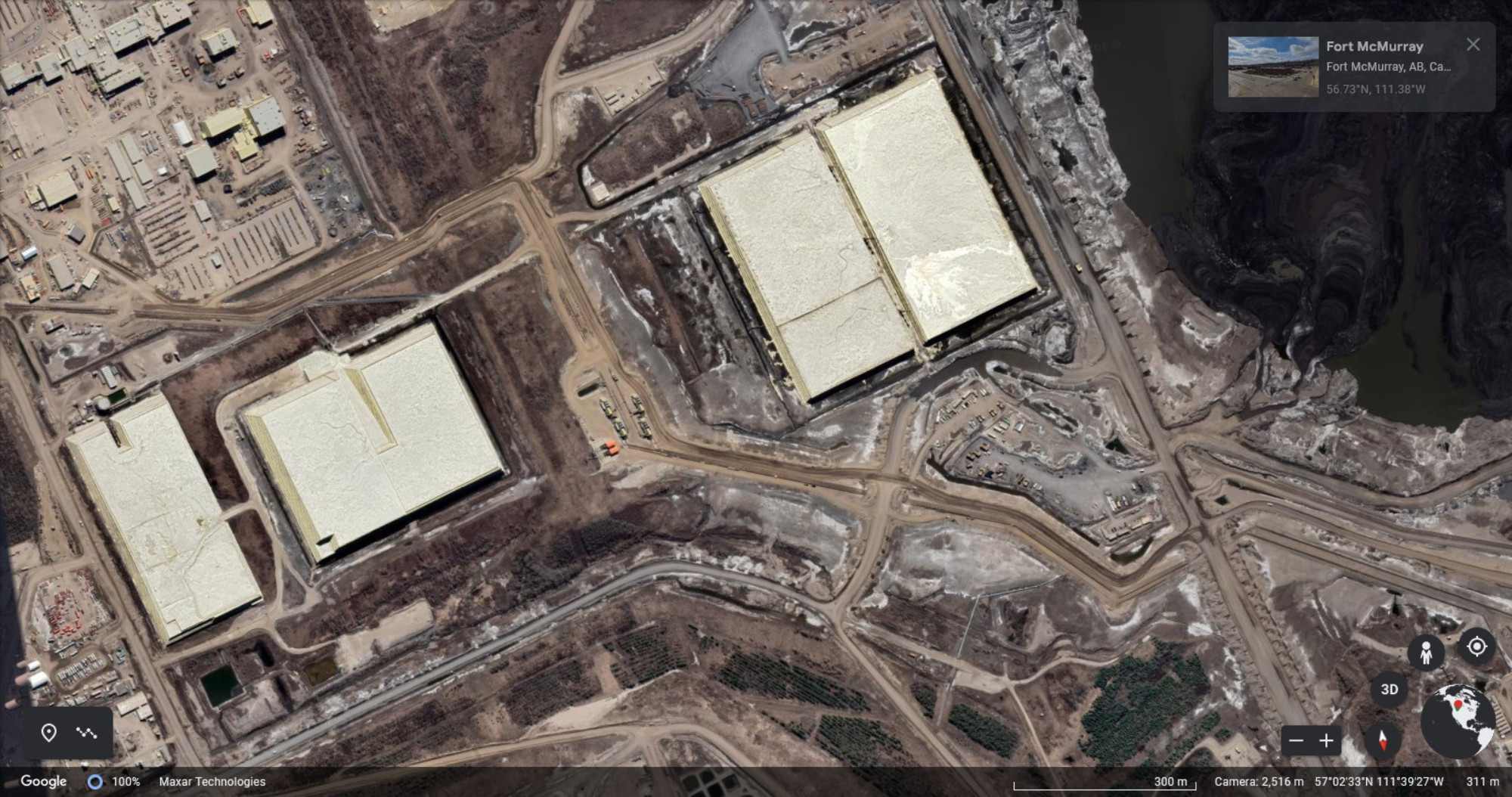 Satellite image of a tar sand mining facility, showing huge piles of sulfur
