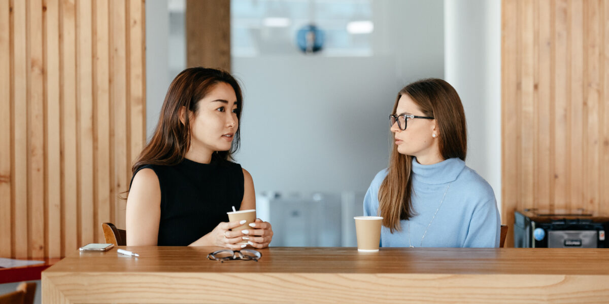 Photo of two people having a conversation