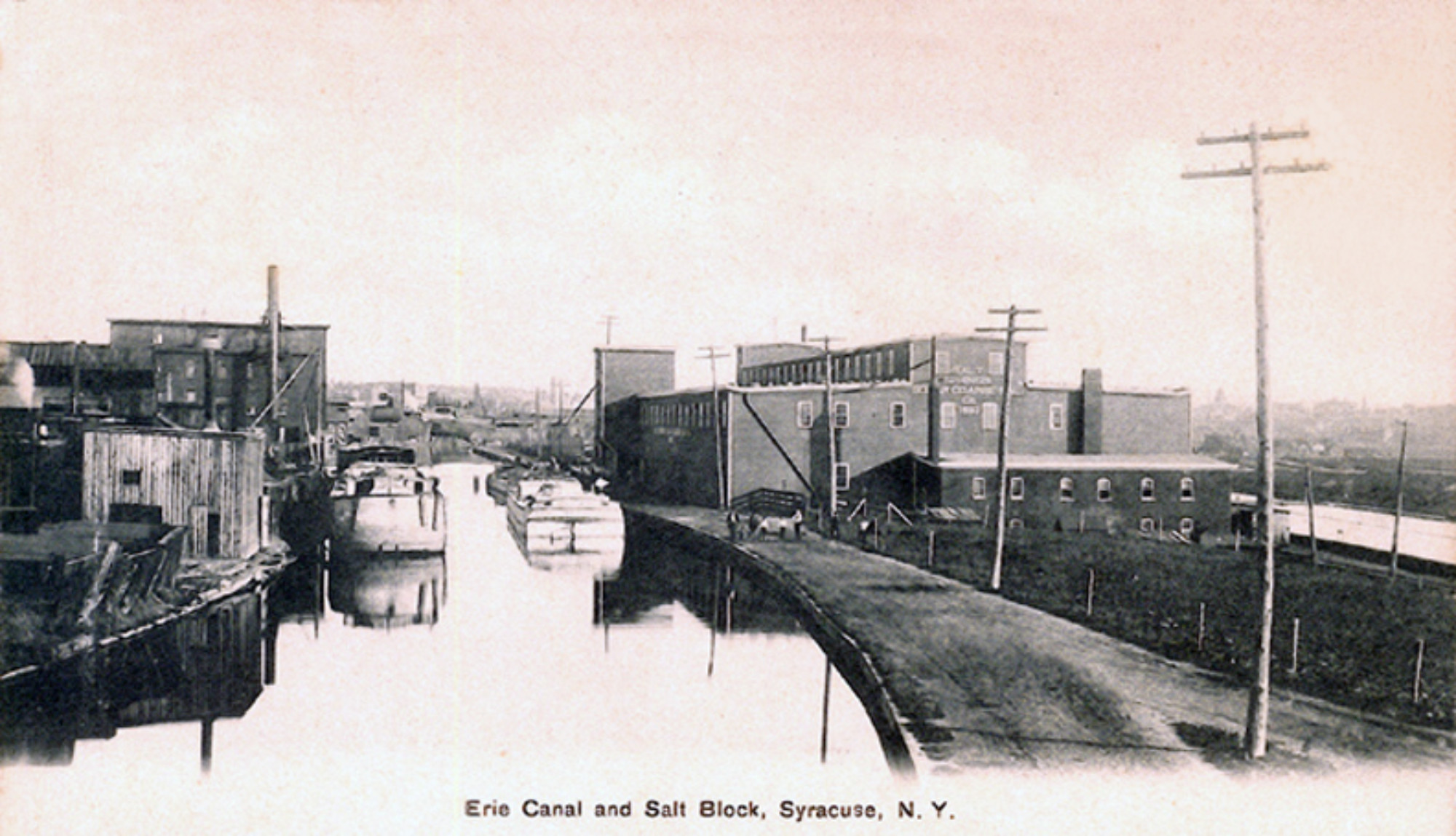 Old black and white photos of buildings along the Erie Canal