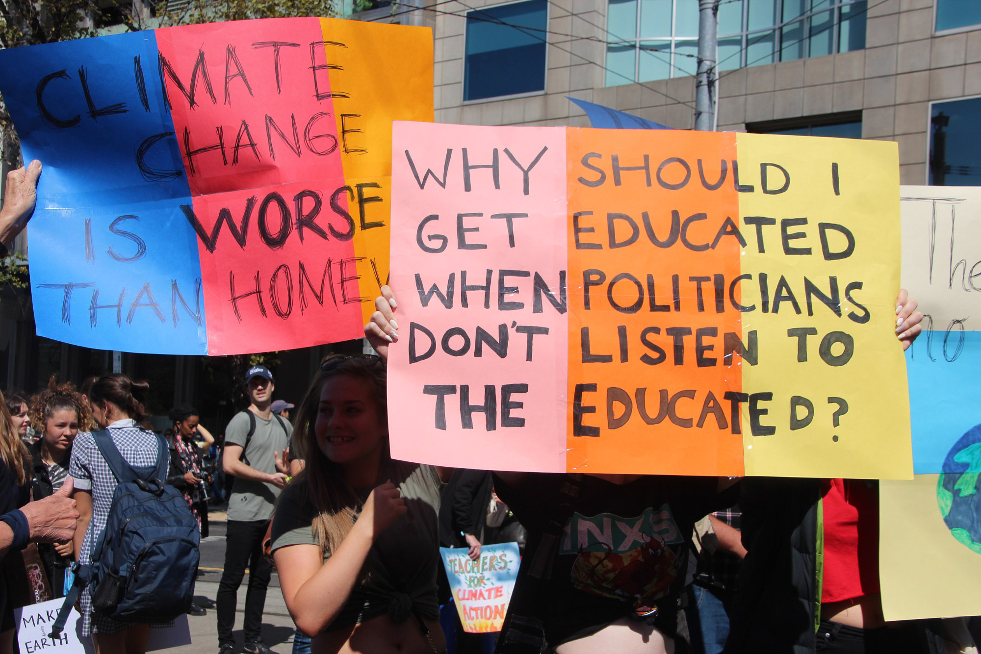 Photo of people carrying signs during a protest march.
