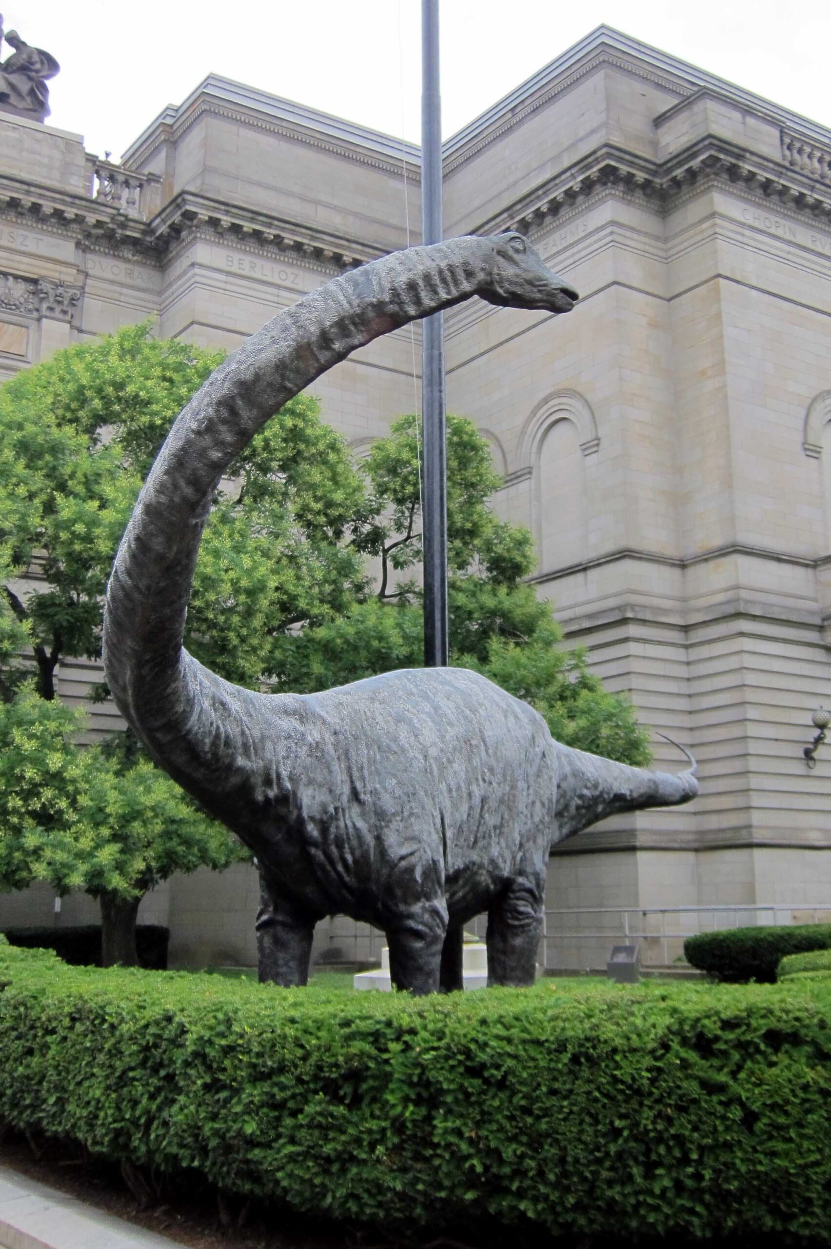 Photo of the Diplodocus dinosaur statue outside of the Carnegie Museum building in Pittsburgh, Pennsylvania.