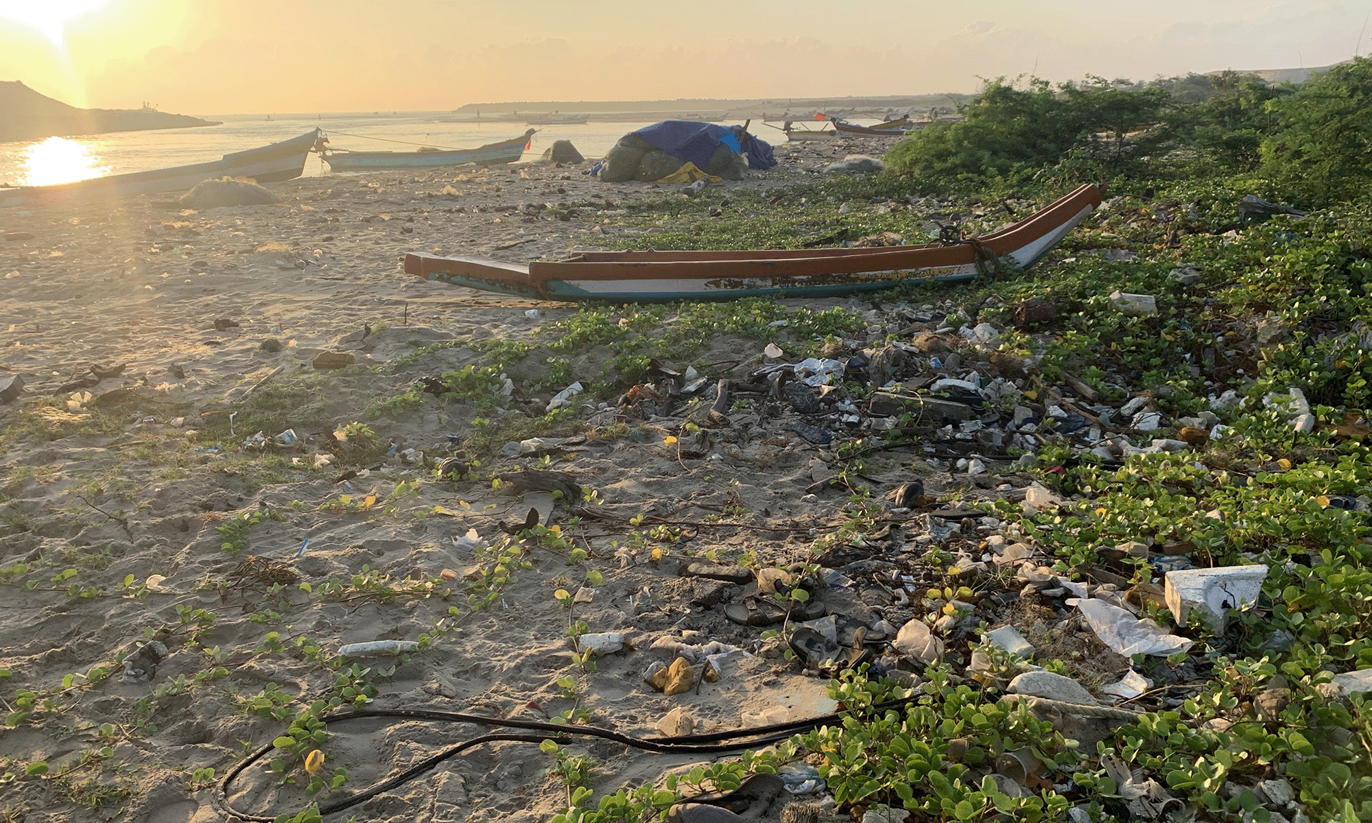 Photo of discarded plastic washed ashore on the beach of Tamil Nadu, India.