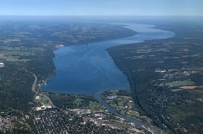 Aerial view of Cayuga Lake, with algal blooms visible in the water