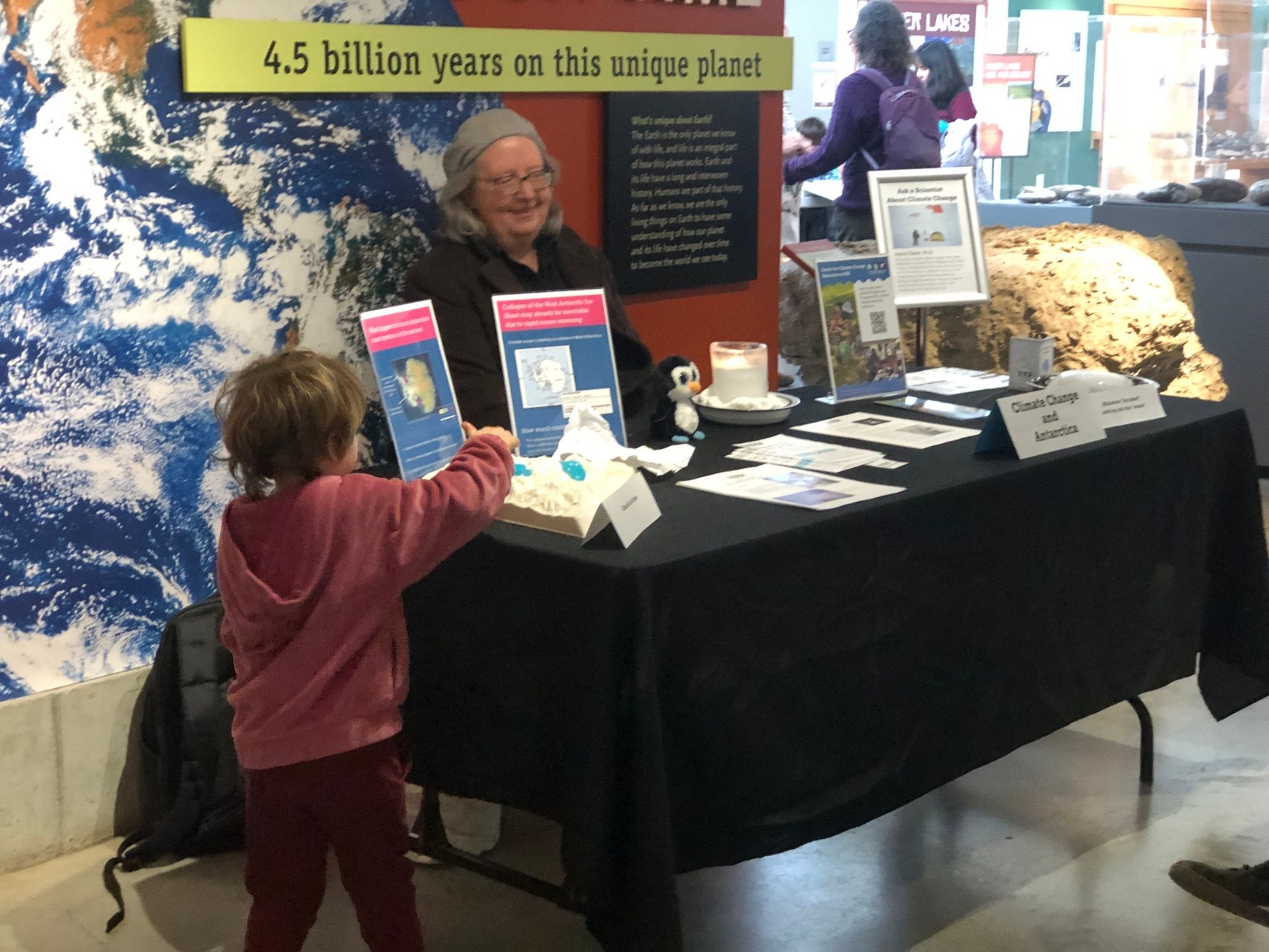 Photo of a table in a museum with educational activities about climate change